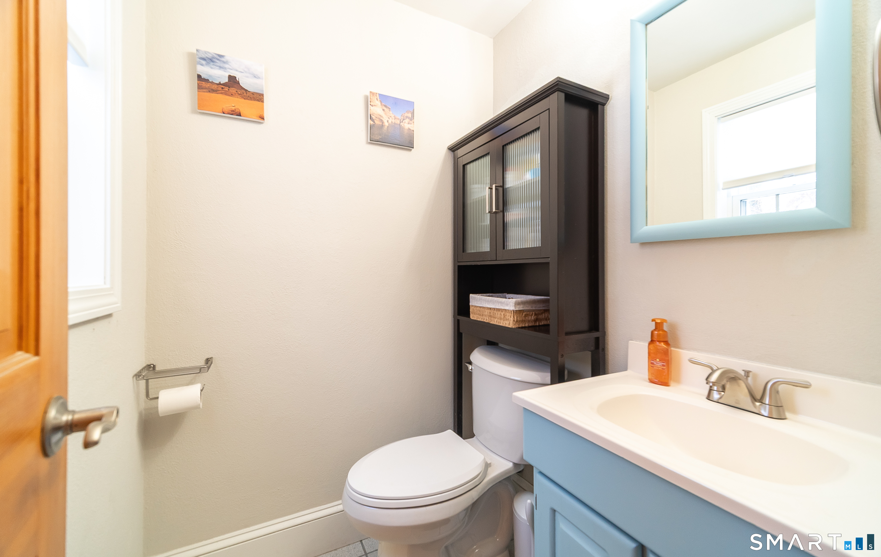 45 Craig Avenue Southington, CT 06489 - Photo 22 of 40 a bathroom with a toilet sink vanity and mirror