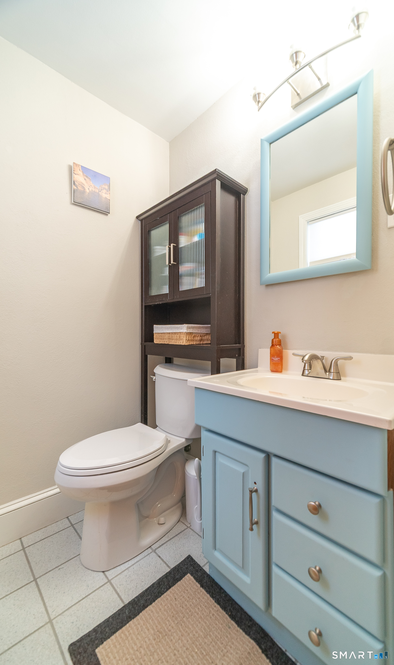 45 Craig Avenue Southington, CT 06489 - Photo 23 of 40 a bathroom with a toilet a sink a vanity and mirror