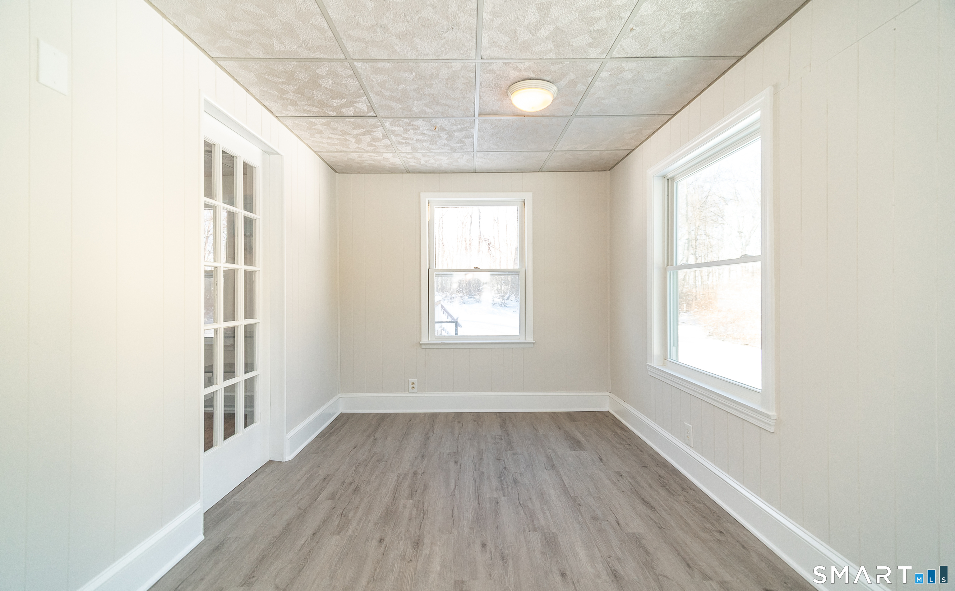 45 Craig Avenue Southington, CT 06489 - Photo 25 of 40 an empty room with wooden floor and windows
