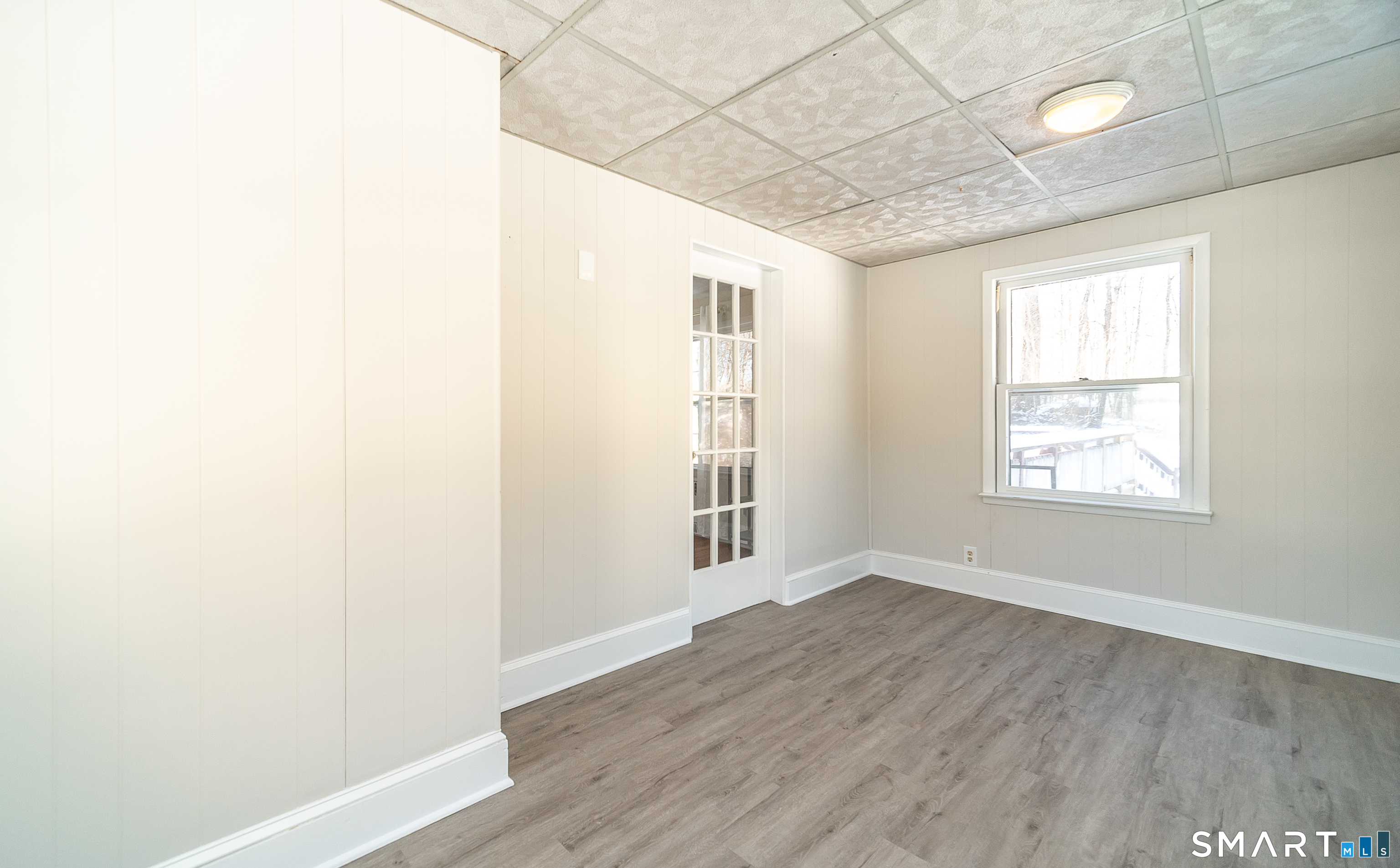 45 Craig Avenue Southington, CT 06489 - Photo 26 of 40 an empty room with wooden floor and windows