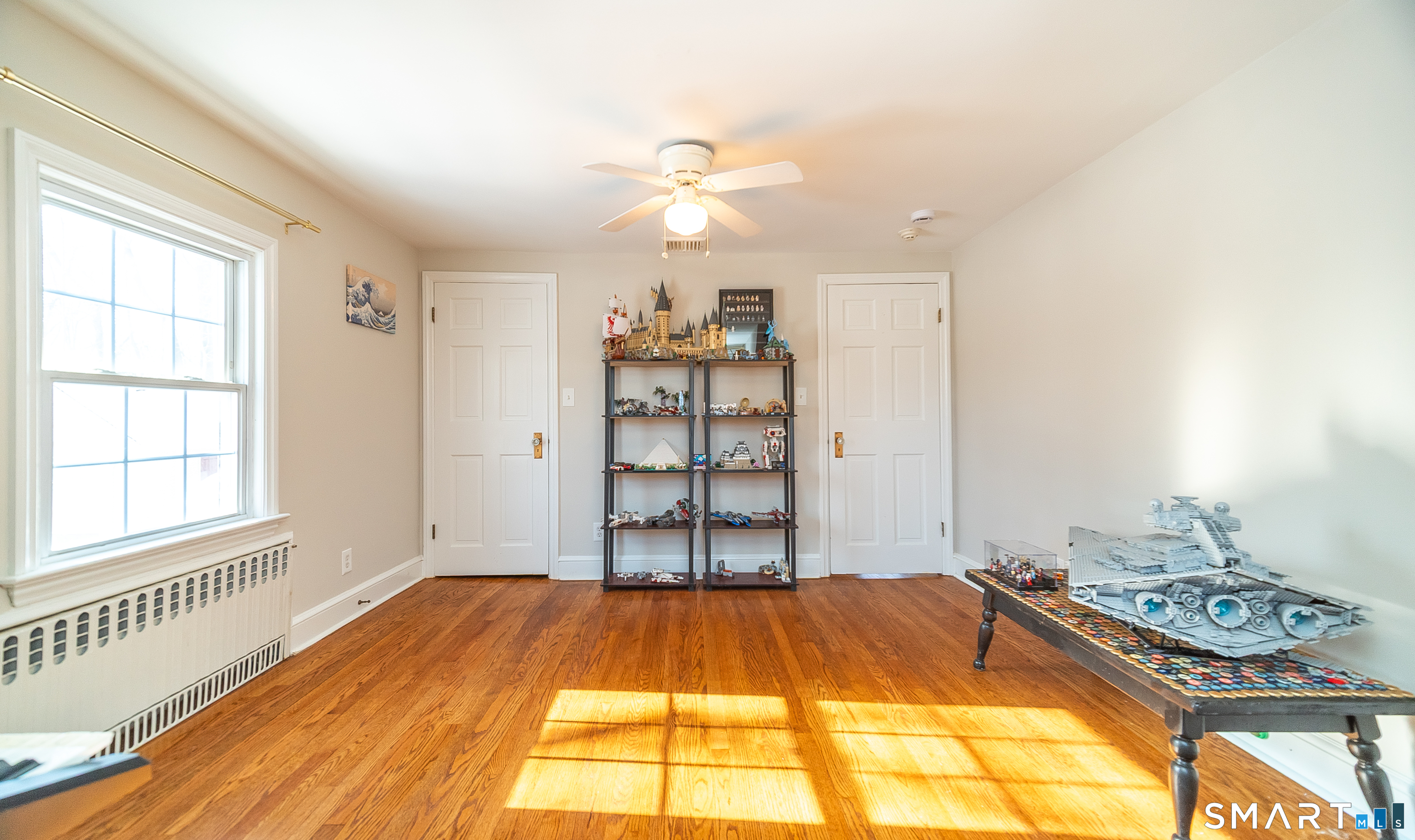 45 Craig Avenue Southington, CT 06489 - Photo 30 of 40 a bedroom with a bed and a chandelier