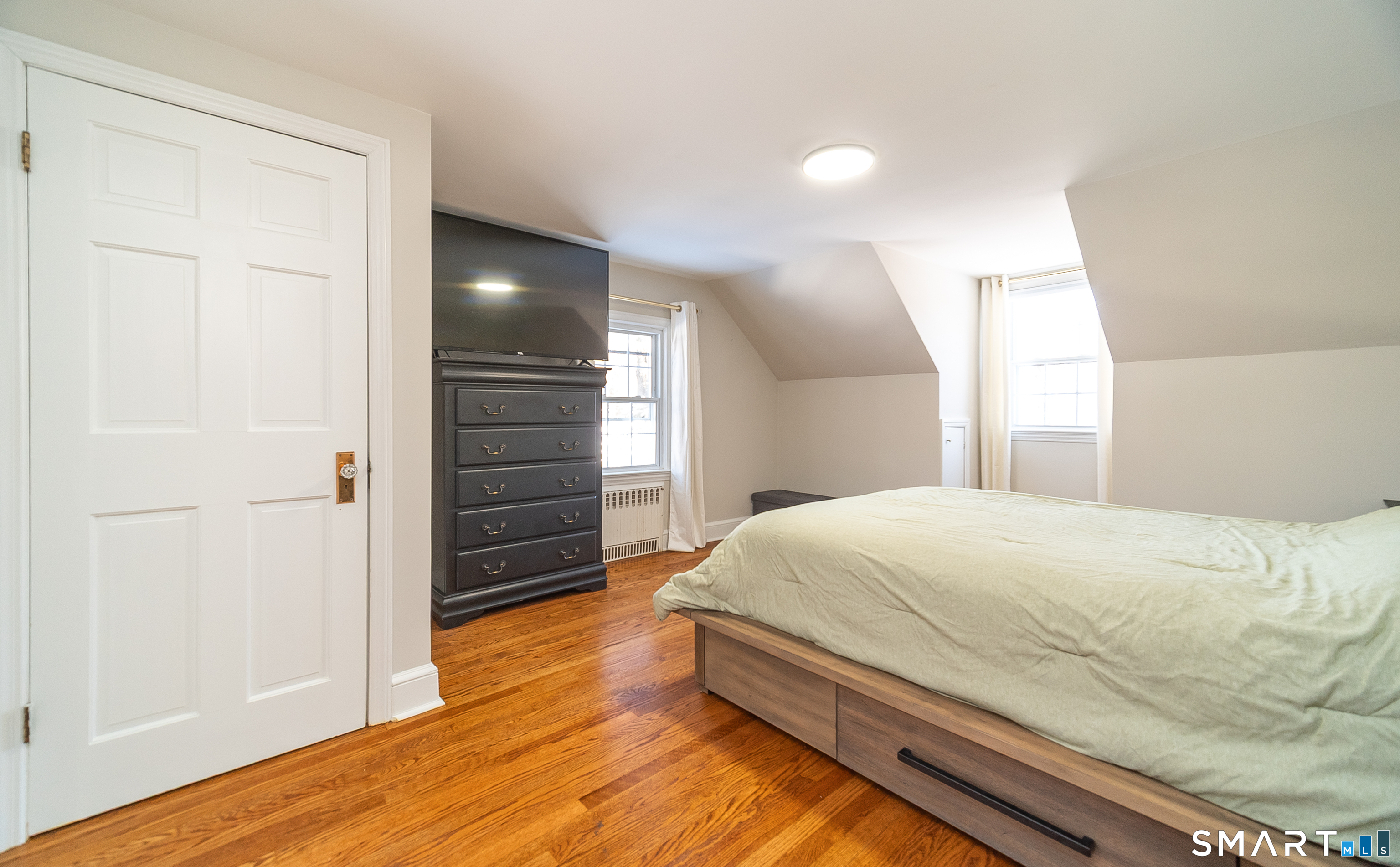 45 Craig Avenue Southington, CT 06489 - Photo 35 of 40 a bedroom with a bed and wooden floor