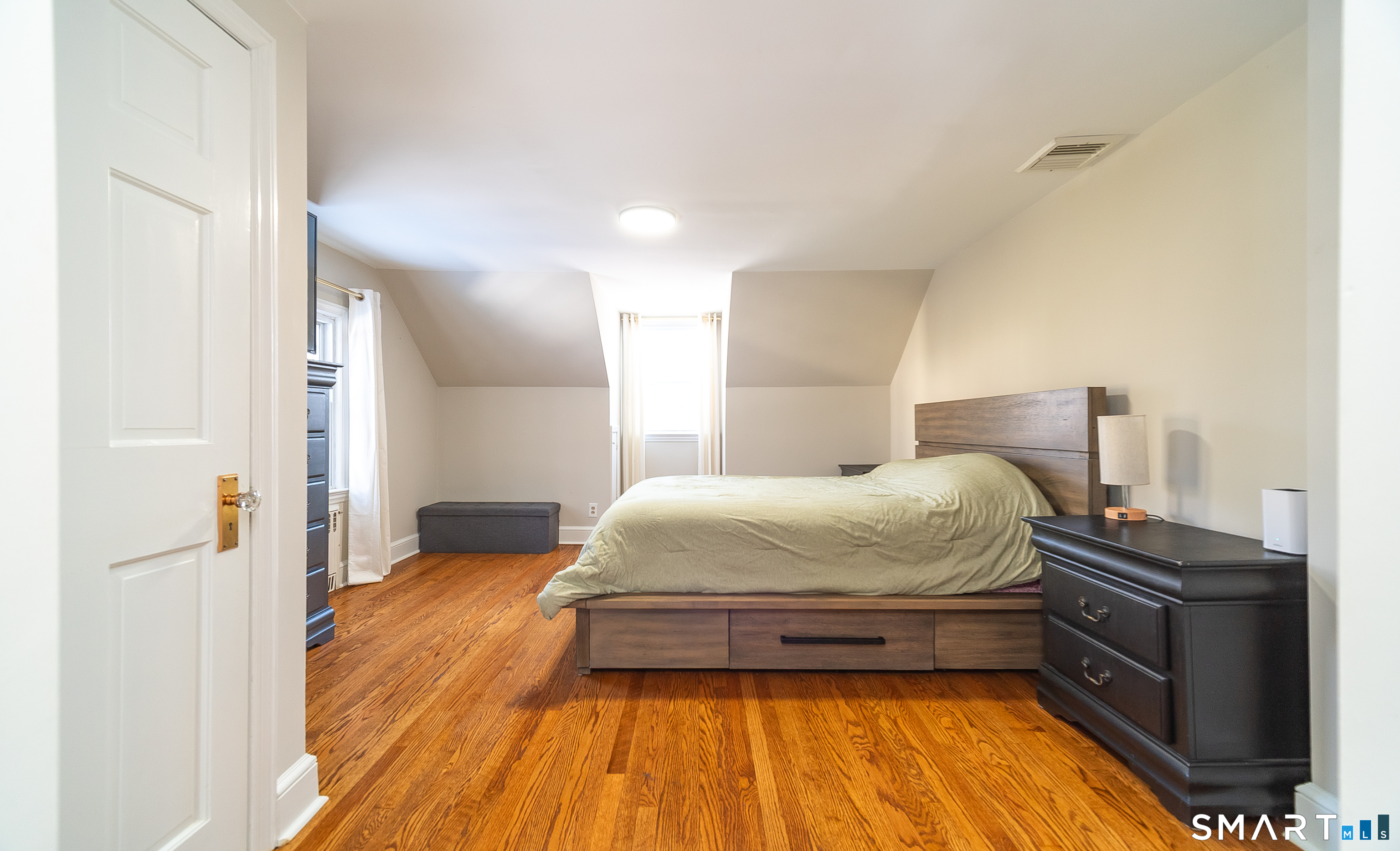 45 Craig Avenue Southington, CT 06489 - Photo 36 of 40 a bedroom with a bed and wooden floor