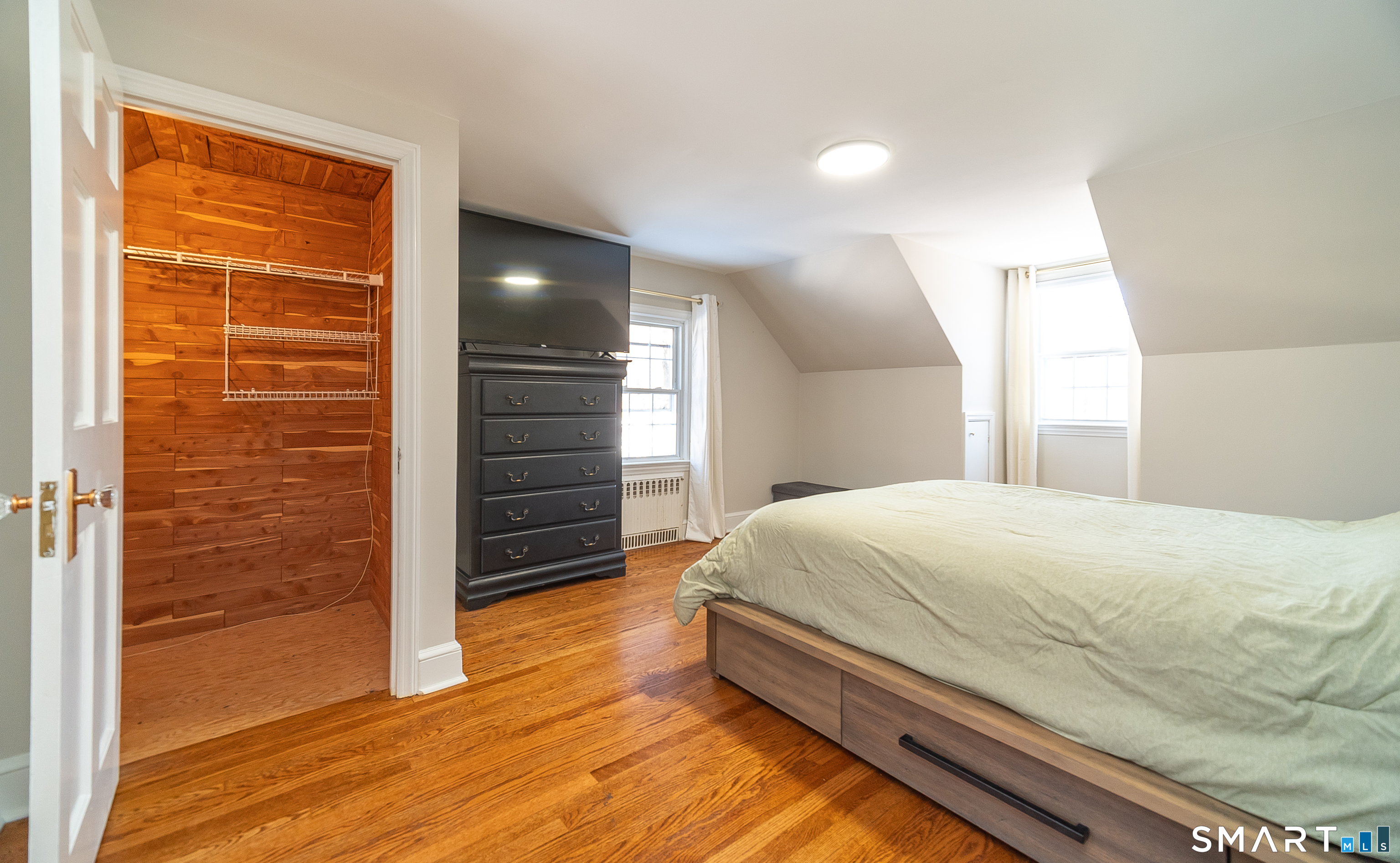 45 Craig Avenue Southington, CT 06489 - Photo 39 of 40 a bedroom with a bed and a flat tv screen