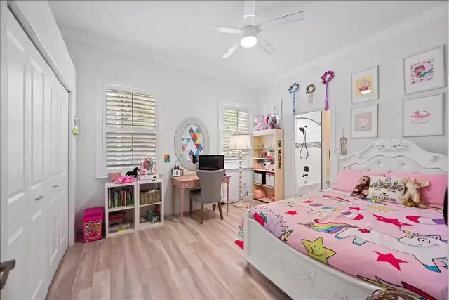 a bedroom with a bed and a desk