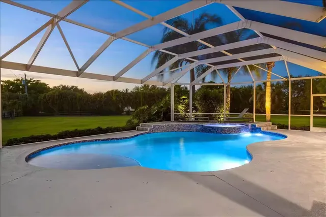 a view of a chairs and table in the patio