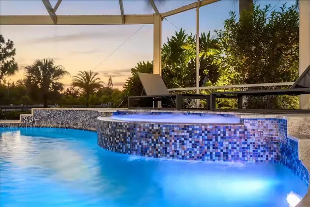 a view of a swimming pool with a patio