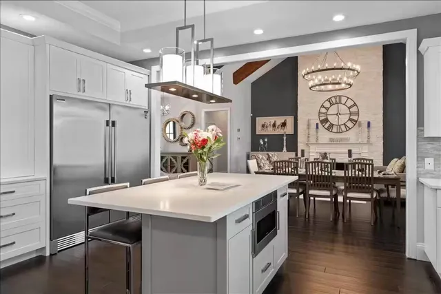 a kitchen with stainless steel appliances granite countertop a stove and refrigerator