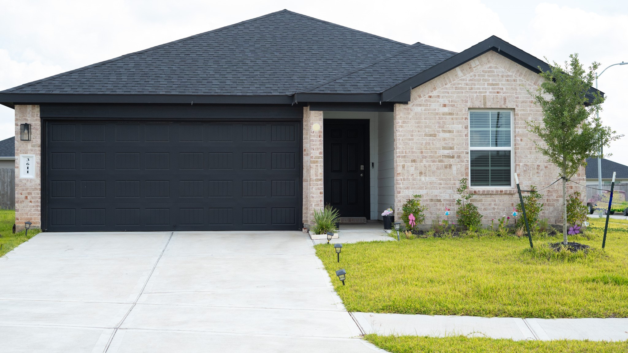 3611 Ashford Grove Fulshear, TX 77441 - Photo 1 of 20 a front view of a house with garden