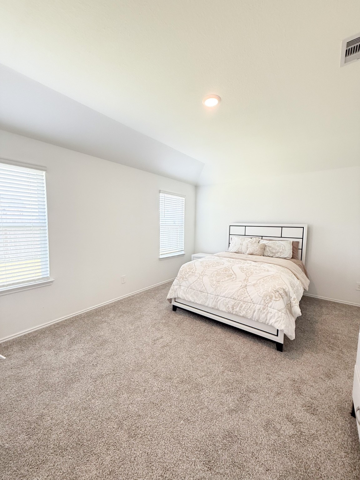 3611 Ashford Grove Fulshear, TX 77441 - Photo 12 of 20 a bedroom with a bed and a window