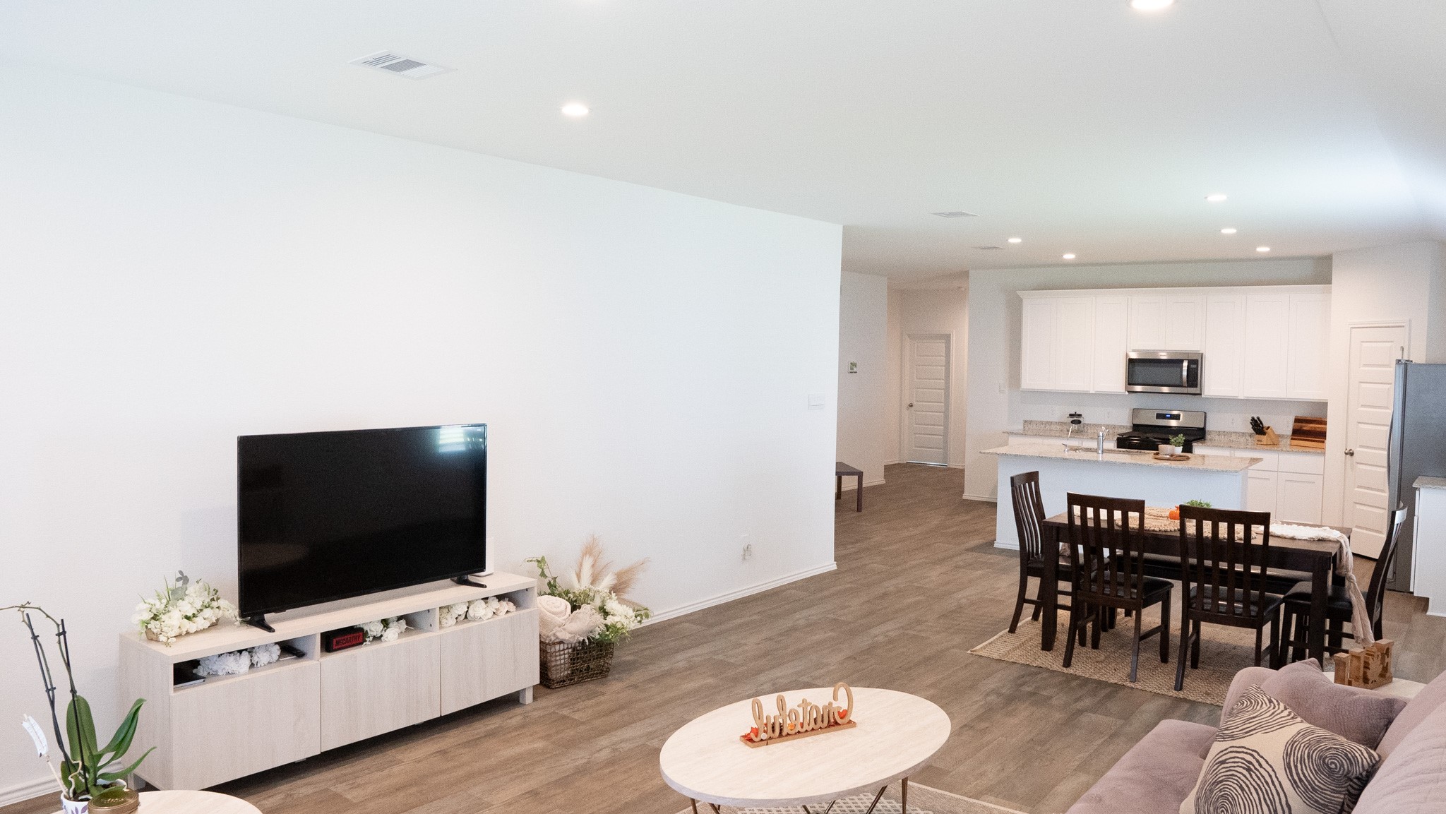 3611 Ashford Grove Fulshear, TX 77441 - Photo 8 of 20 a living room with furniture and a flat screen tv