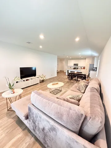 a bedroom with a bed and a television