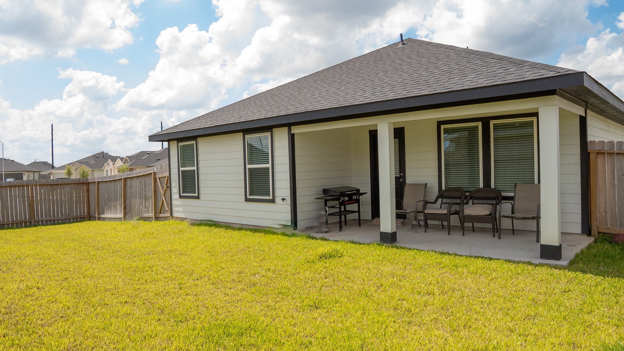 3611 Ashford Grove Fulshear, TX 77441 - Photo 10 of 20 a view of swimming pool with outdoor seating and house in the background