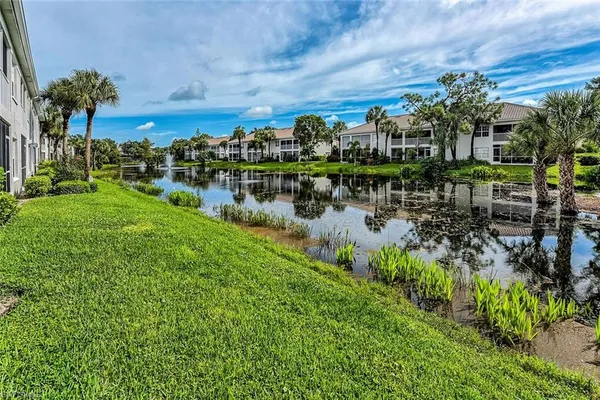 a view of a lake with a building in front of it