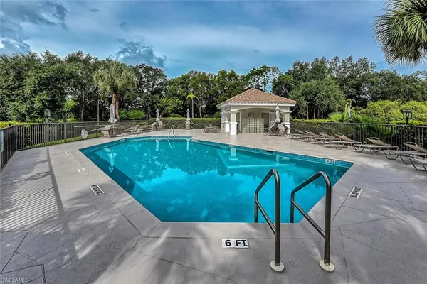 a view of a swimming pool with a patio