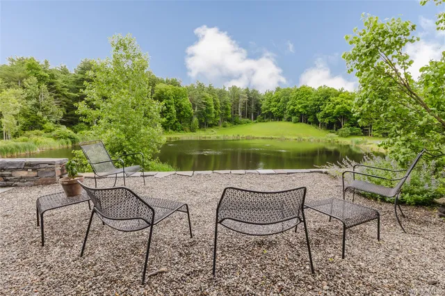 a view of a chairs and table in the patio