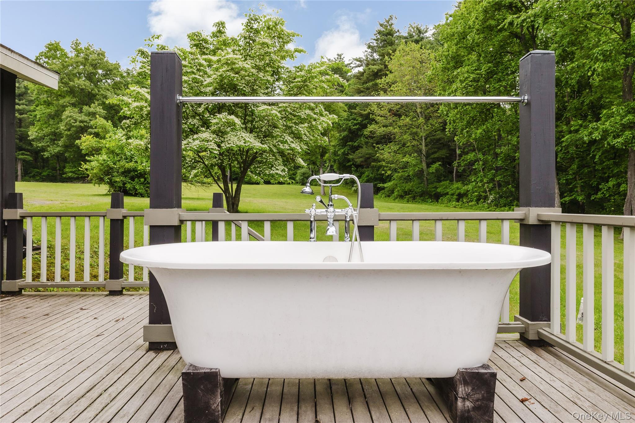 88 Mac Brown Road Claverack, NY 12513 - Photo 27 of 49 a view of a deck with a table and chairs