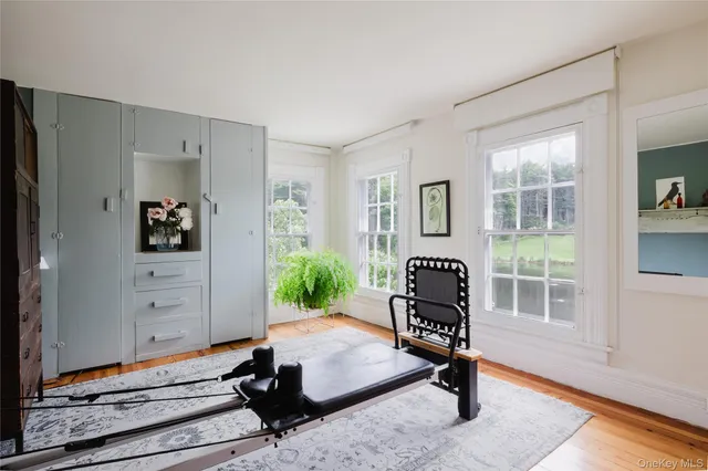 a bedroom with bed and a chandelier