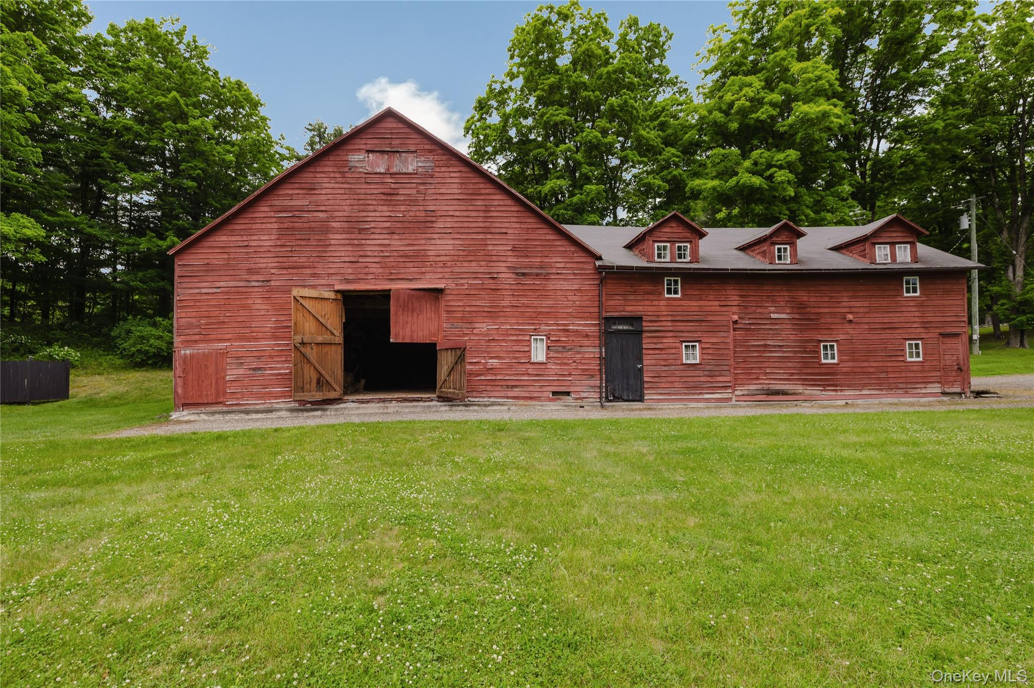 88 Mac Brown Road Claverack, NY 12513 - Photo 5 of 49 a front view of a house with a garden