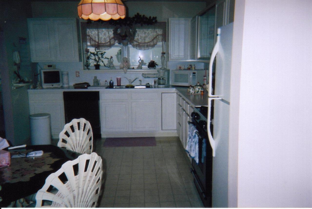 5524 Granite Road Long Pond, PA 18334 - Photo 2 of 5 a kitchen with a sink a stove and a refrigerator