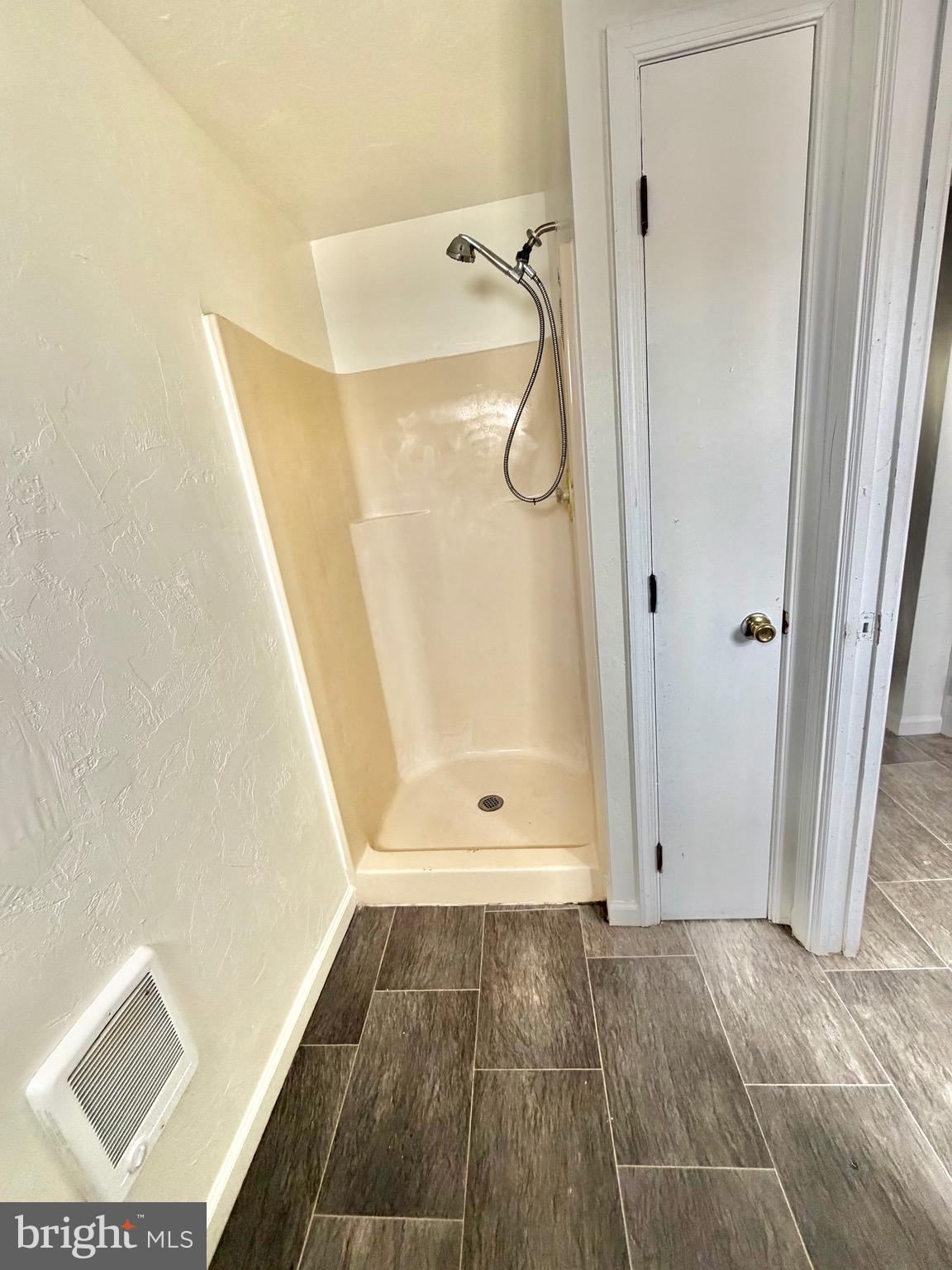 1211 West Poplar Street York, PA 17404 - Photo 16 of 38 a bathroom with a glass shower door