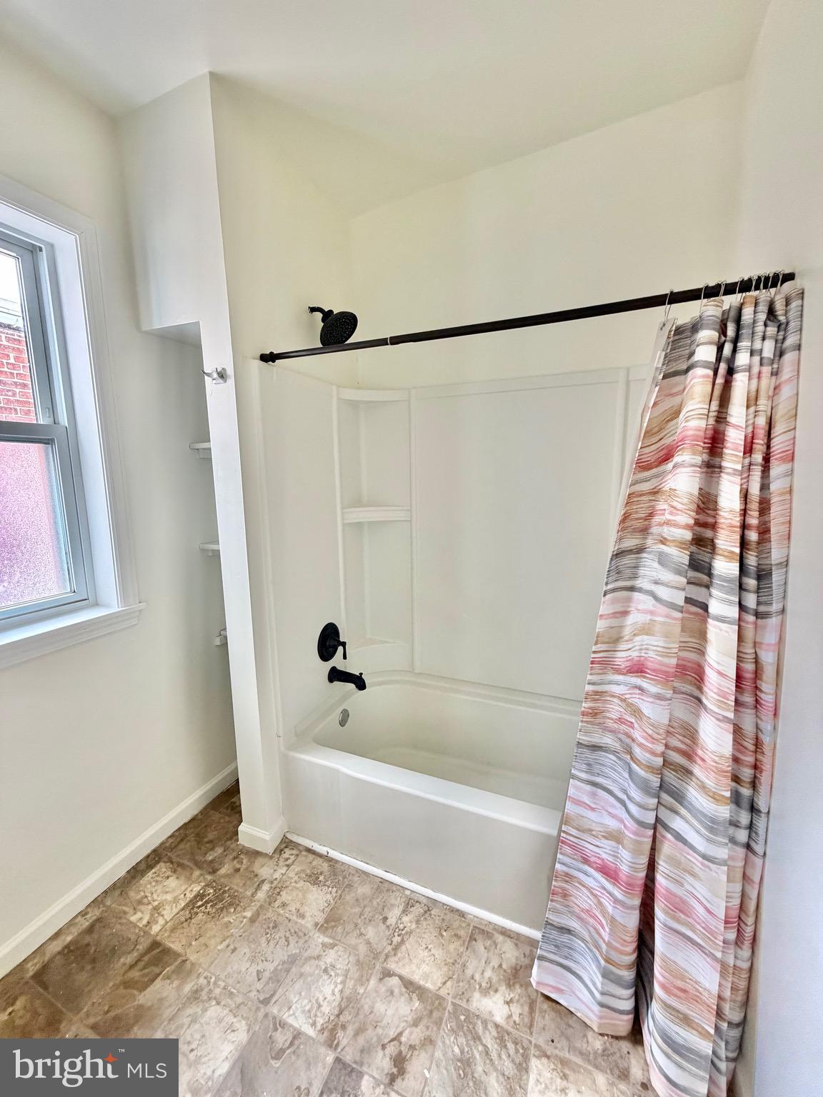 1211 West Poplar Street York, PA 17404 - Photo 22 of 38 a bathroom with a bathtub and a shower
