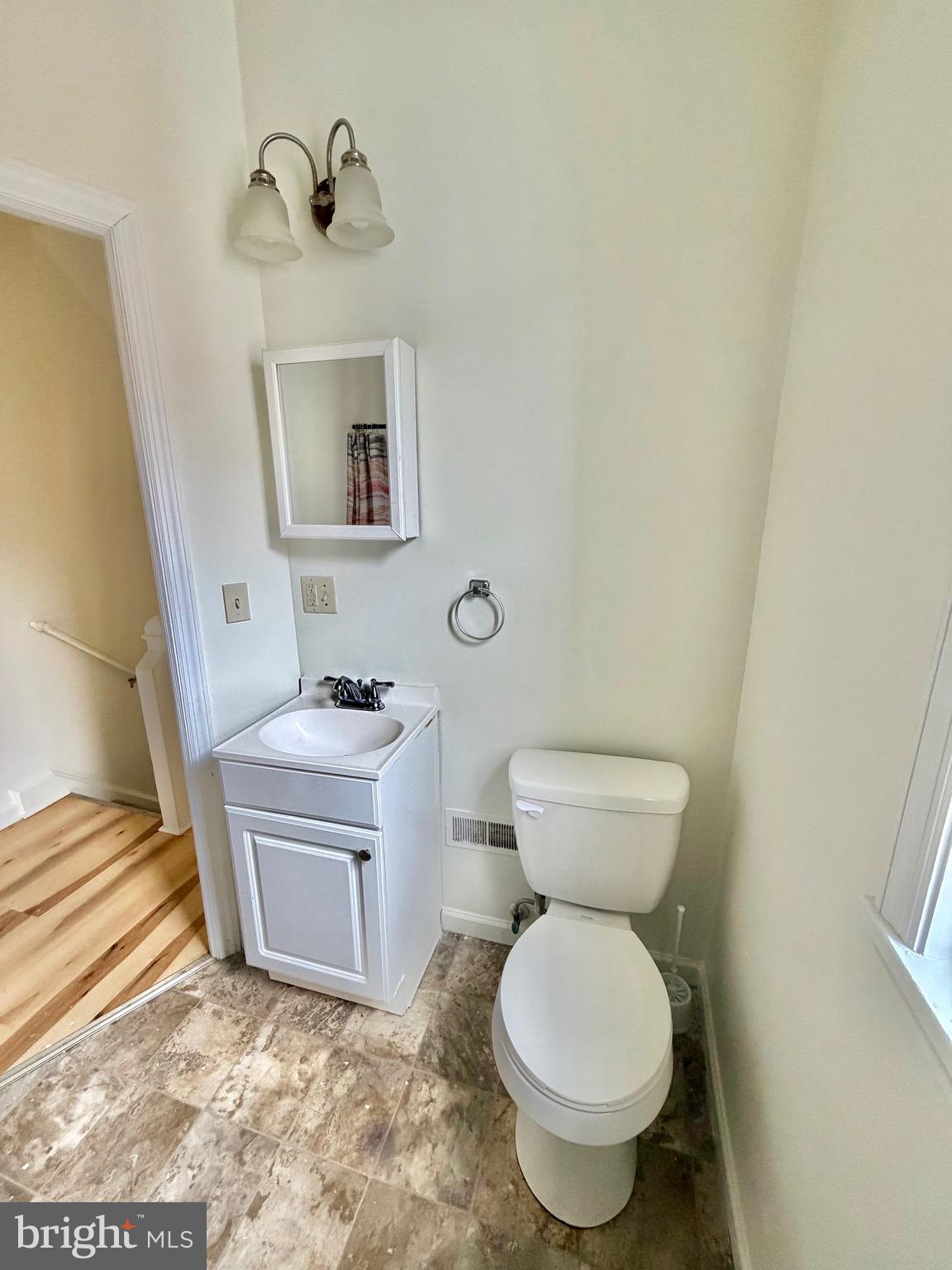 1211 West Poplar Street York, PA 17404 - Photo 23 of 38 a bathroom with a sink toilet and a mirror