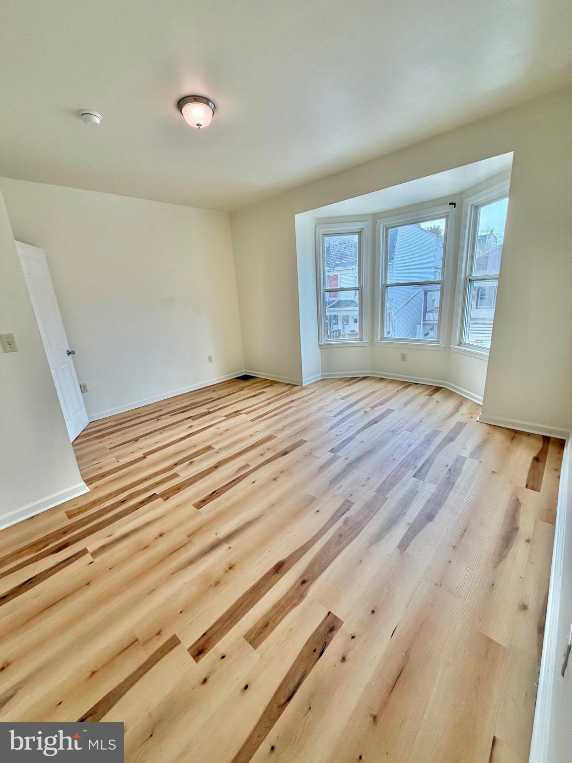1211 West Poplar Street York, PA 17404 - Photo 28 of 38 a view of empty room with wooden floor and fan