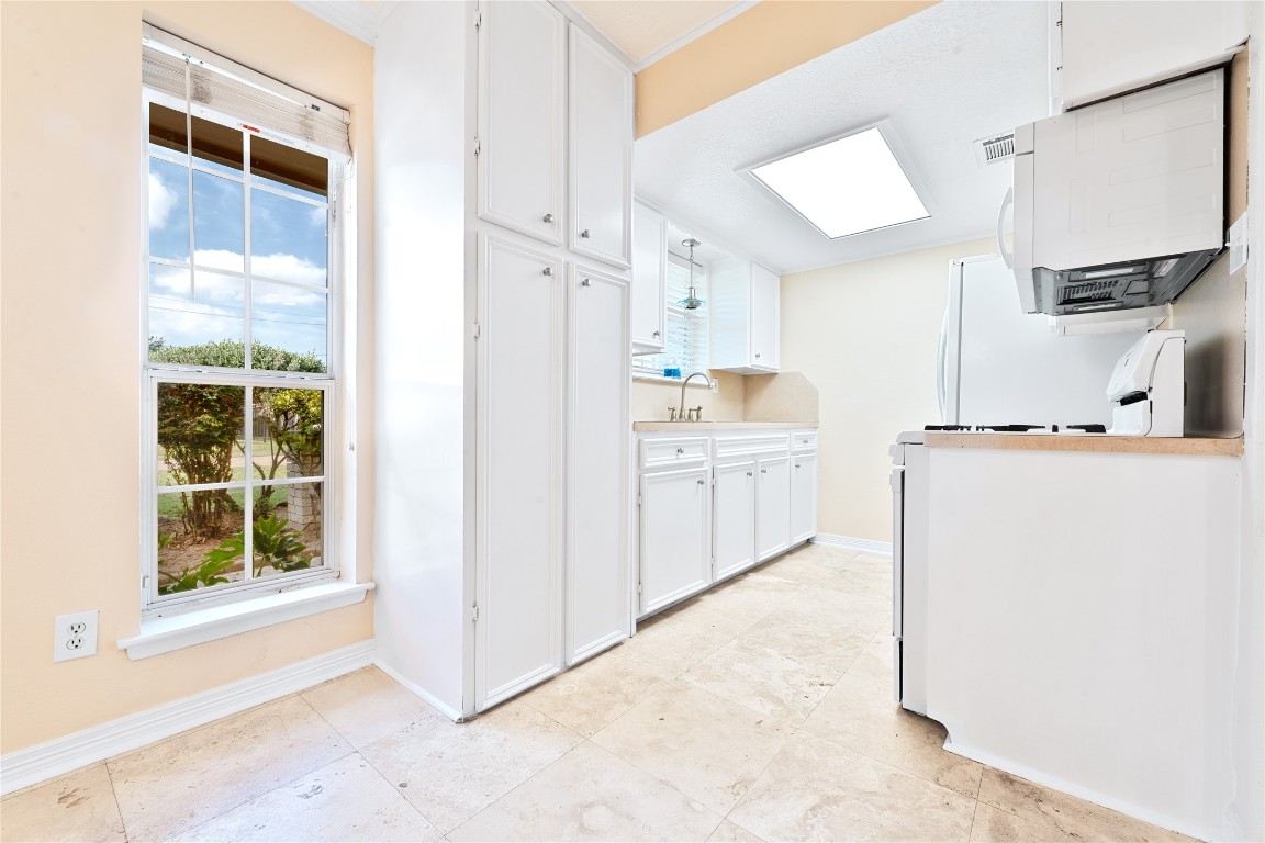 4214 Monitor Street Houston, TX 77093 - Photo 12 of 21 a view of a kitchen with electric appliances