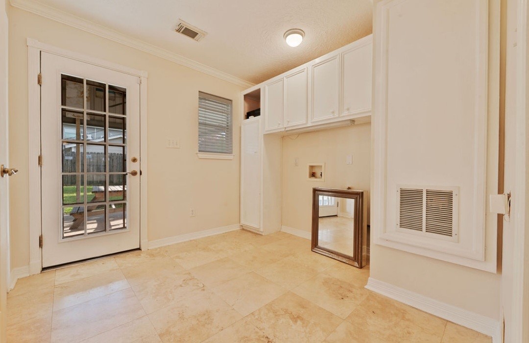 4214 Monitor Street Houston, TX 77093 - Photo 13 of 21 an empty room with windows and cabinet