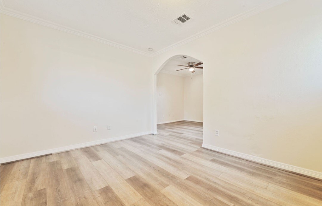 4214 Monitor Street Houston, TX 77093 - Photo 15 of 21 a view of a room with wooden floor and white walls
