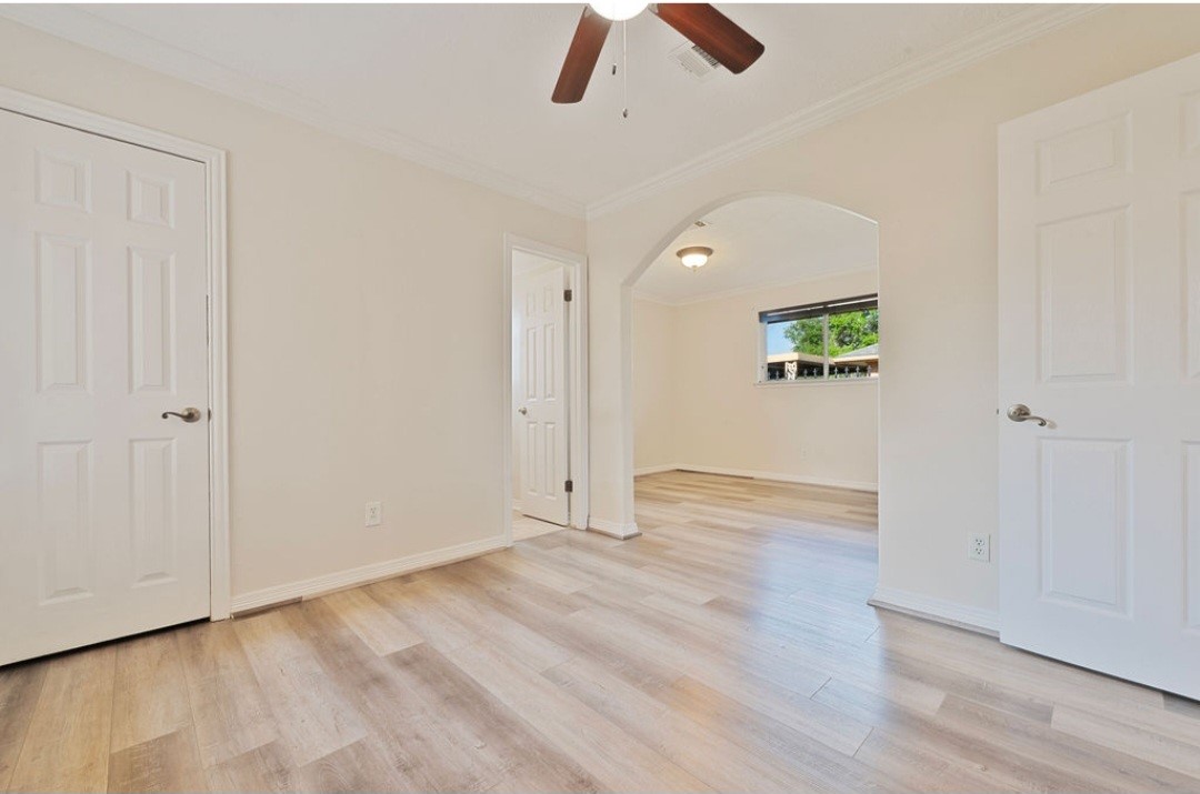 4214 Monitor Street Houston, TX 77093 - Photo 16 of 21 wooden floor in an empty room with a window