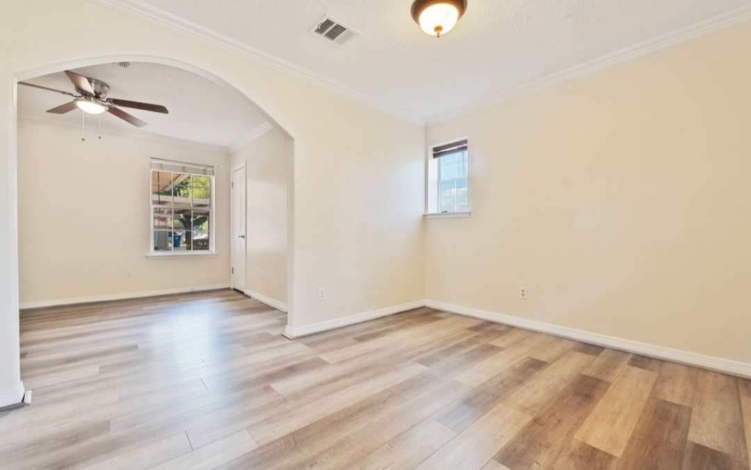 4214 Monitor Street Houston, TX 77093 - Photo 17 of 21 wooden floor in an empty room with a window
