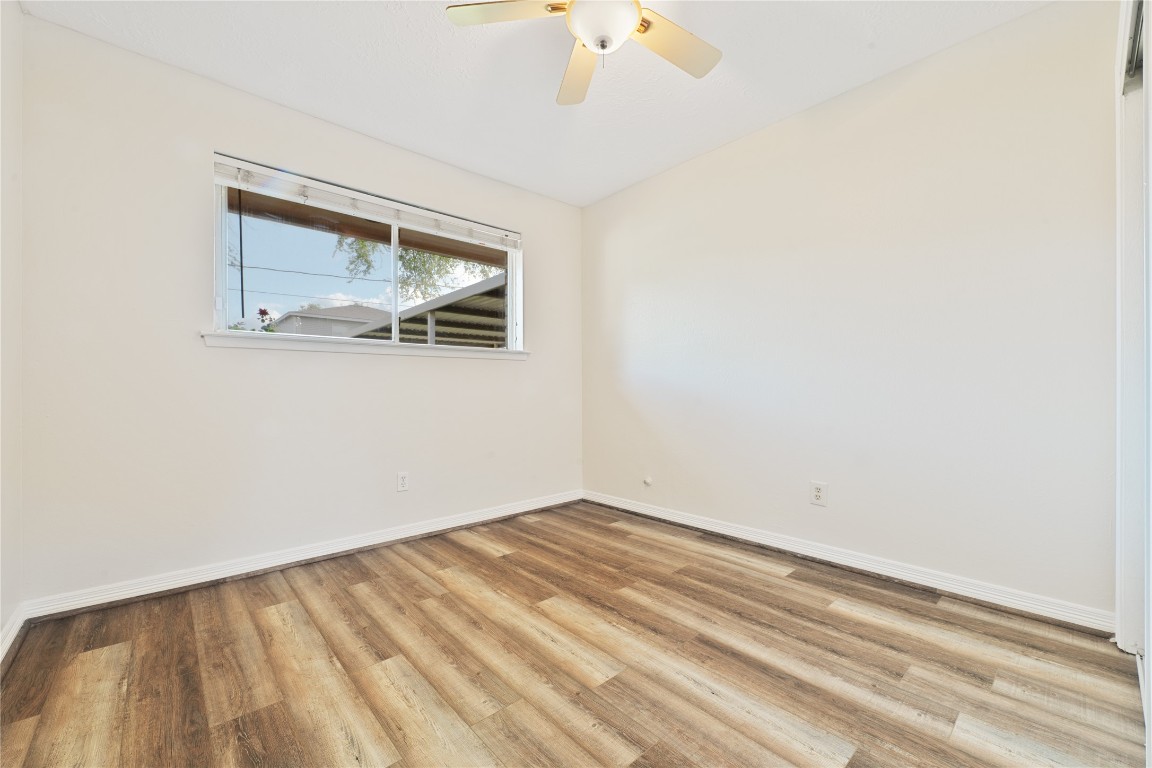 4214 Monitor Street Houston, TX 77093 - Photo 19 of 21 a view of a small space with wooden floor and a window