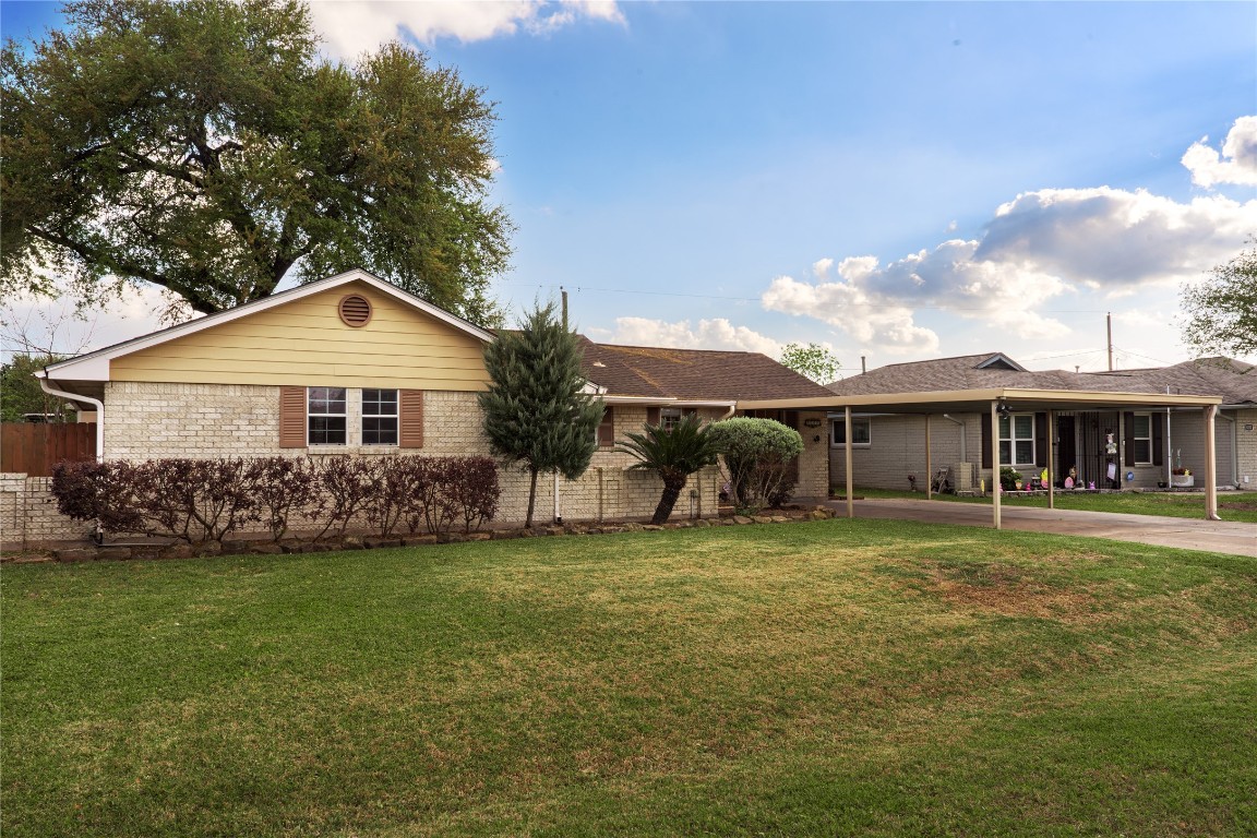 4214 Monitor Street Houston, TX 77093 - Photo 2 of 21 a front view of a house with a garden