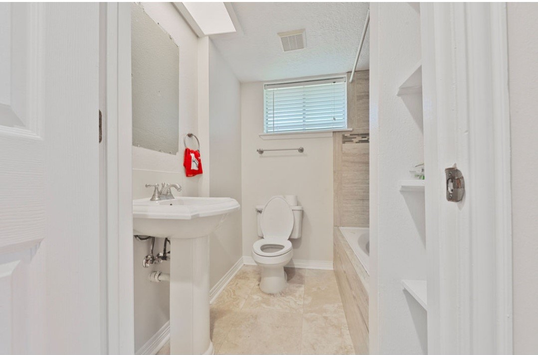 4214 Monitor Street Houston, TX 77093 - Photo 21 of 21 a bathroom with a sink toilet and shower
