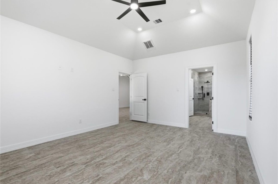 214 Manor Avenue Arcola, TX 77583 - Photo 17 of 26 an empty room with a ceiling fan and window