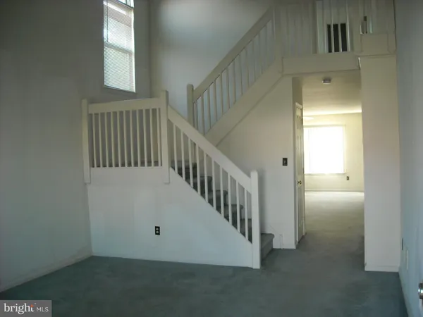 a view of a hallway with entryway