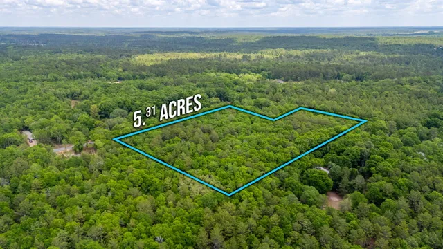 a view of a sign that is in front of a field