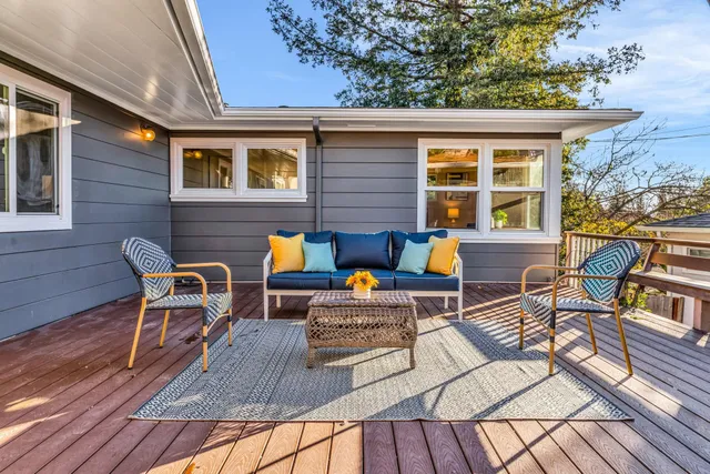 a outdoor space with patio the couches and a dining table with chairs
