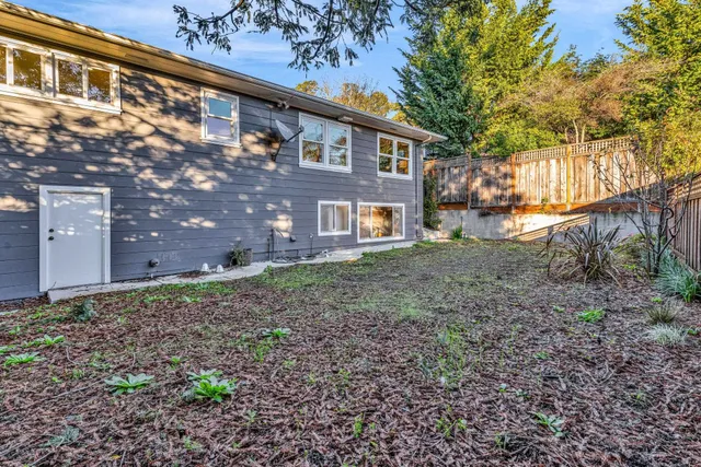 a backyard of a house with lots of green space