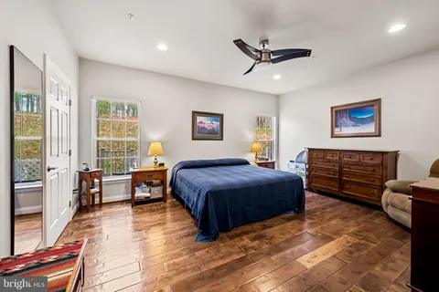 a bedroom with a bed furniture and a window