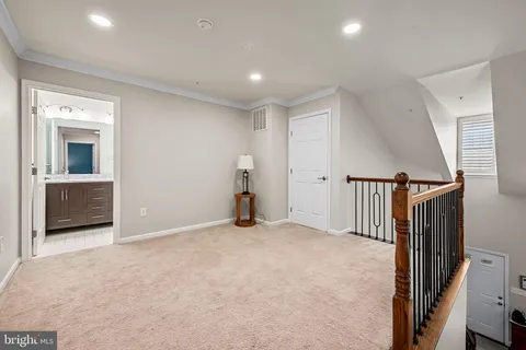 a view of an empty room with a fireplace