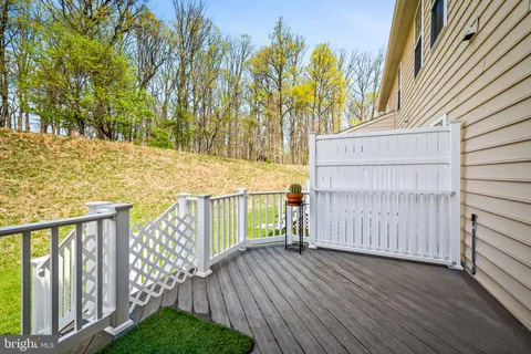 a view of a backyard with wooden fence