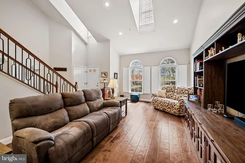 a living room with furniture fireplace and a flat screen tv