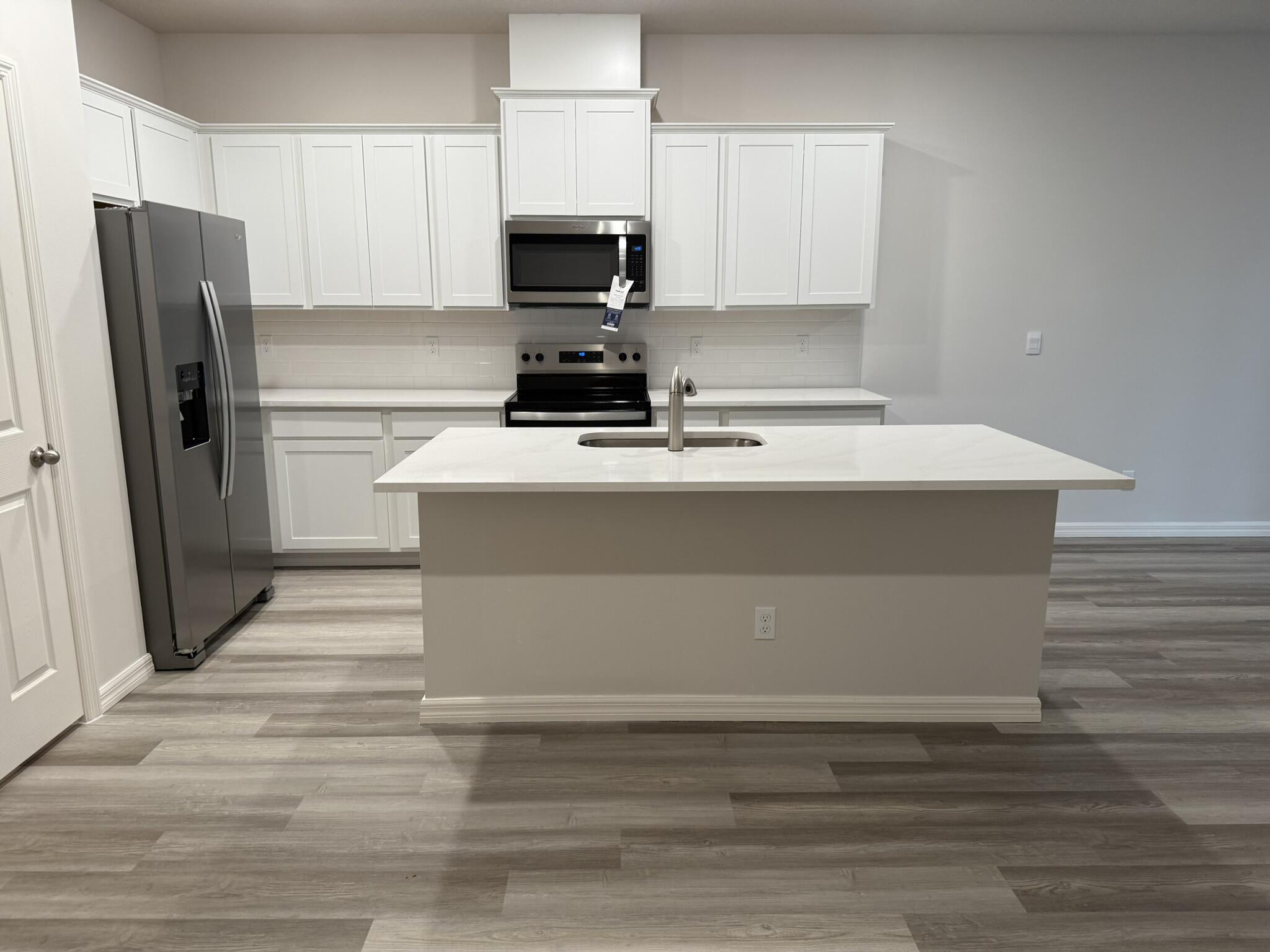 12901 Southwest Forli Way Port St. Lucie, FL 34987 - Photo 5 of 16 a refrigerator freezer sitting inside of a kitchen