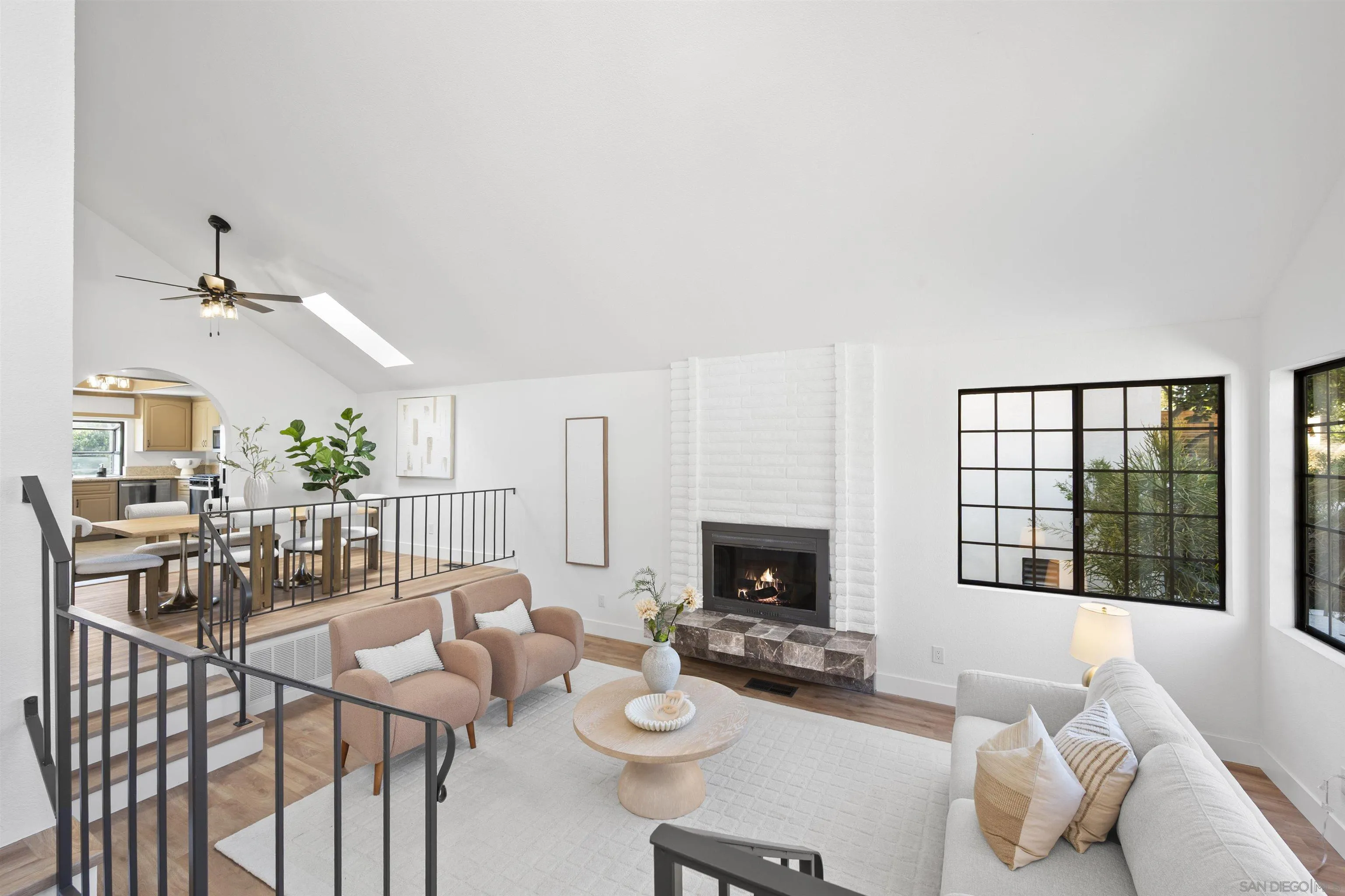 2431 Wilbur Avenue San Diego, CA 92109 - Photo 11 of 56 a living room with furniture and a fireplace