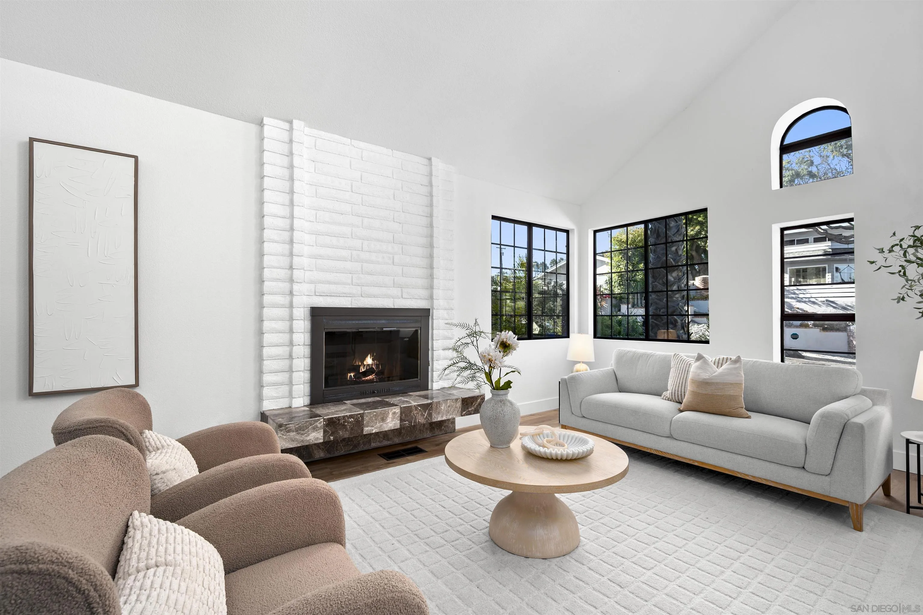 2431 Wilbur Avenue San Diego, CA 92109 - Photo 14 of 56 a living room with furniture and a fireplace