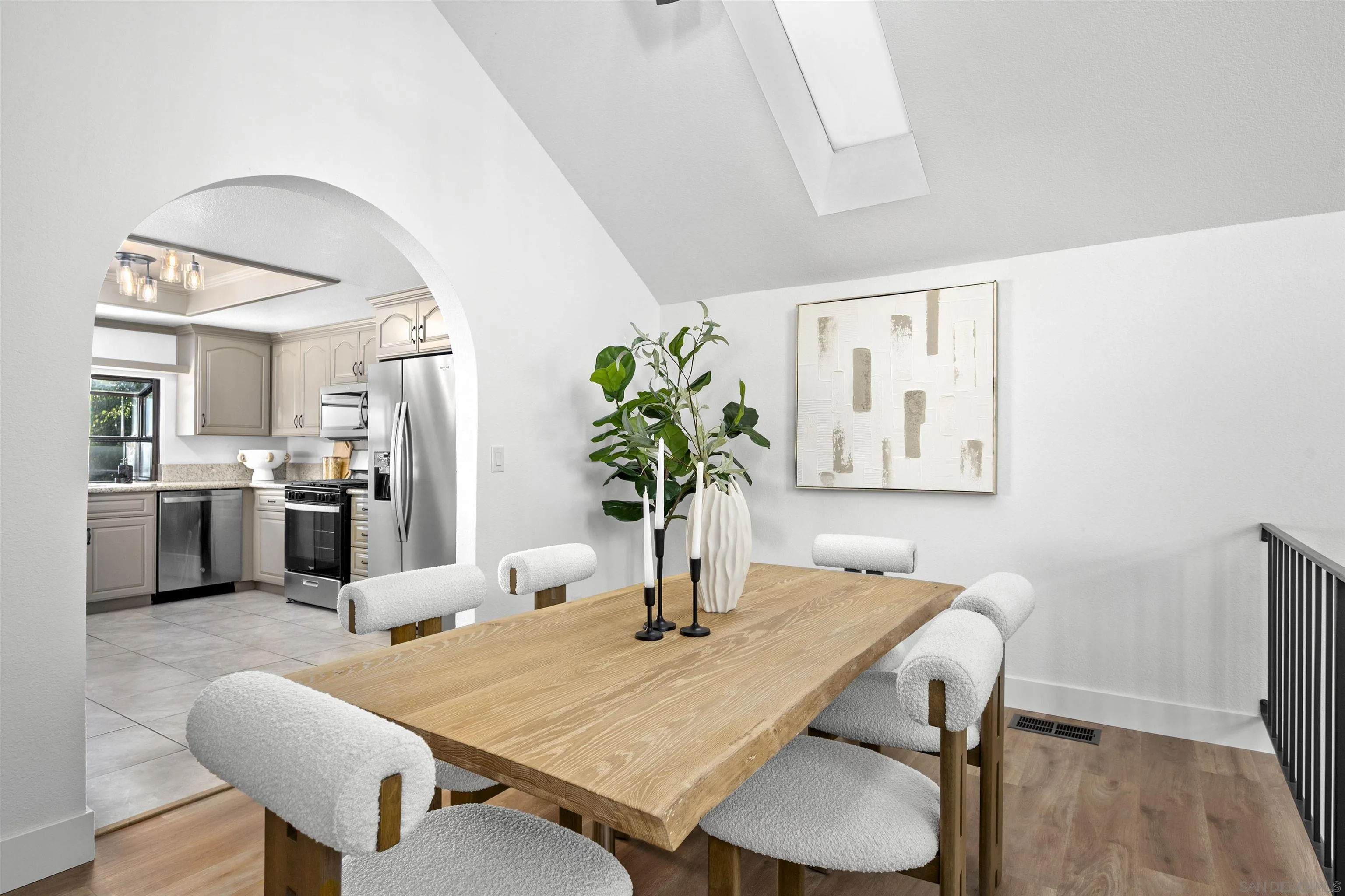 2431 Wilbur Avenue San Diego, CA 92109 - Photo 15 of 56 a dining room with furniture and wooden floor