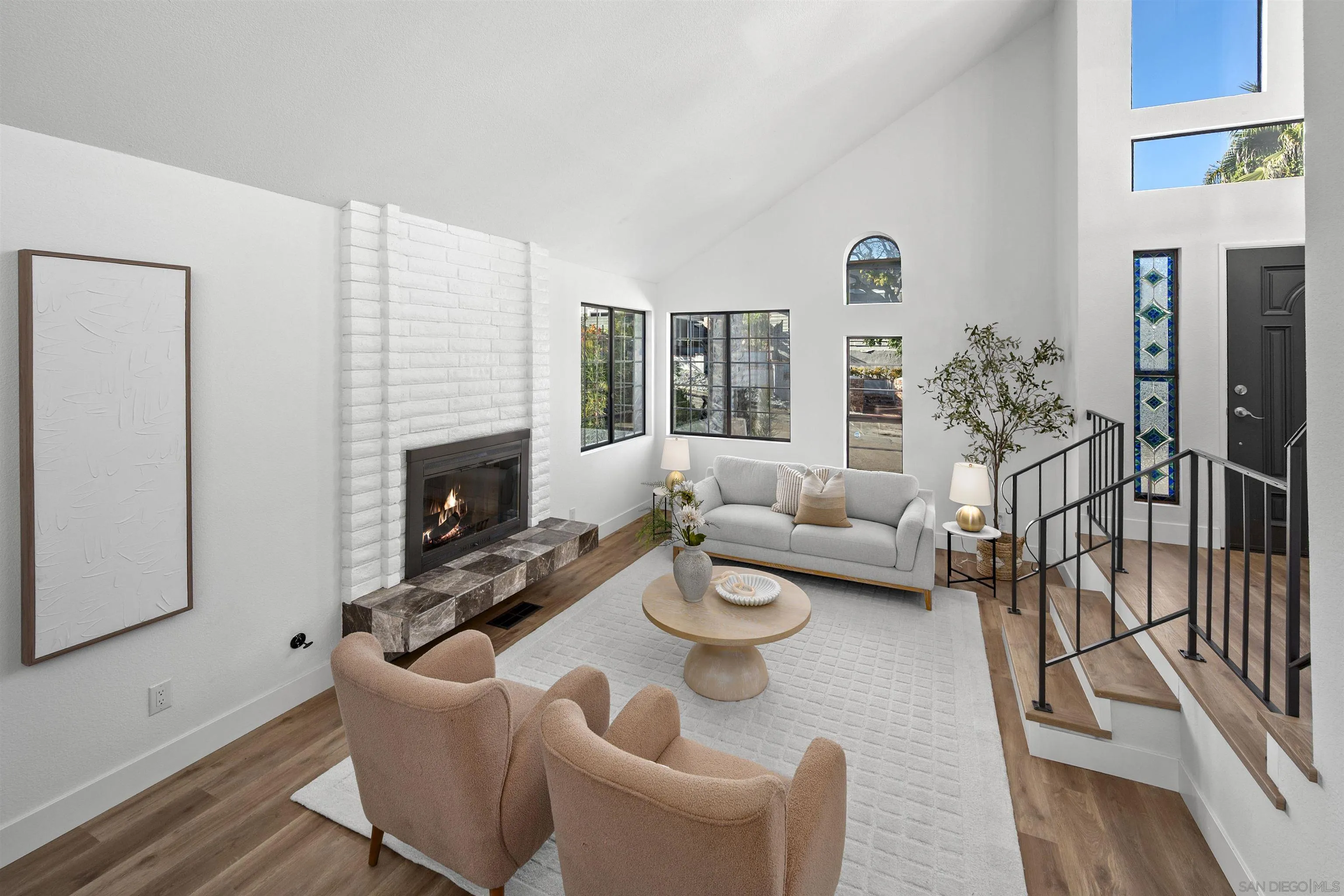 2431 Wilbur Avenue San Diego, CA 92109 - Photo 17 of 56 a living room with furniture and a fireplace